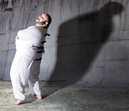Lawrence Goldhuber in straitjacket, photo by Josh Gosfield